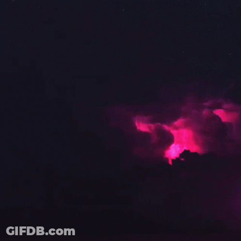 A Pink Lightning Bolt Is Coming Out Of A Cloud GIF