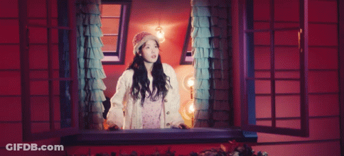 A Pink Moon Is Surrounded By Purple Clouds In The Night Sky . GIF