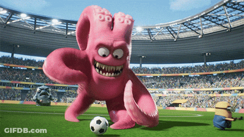 A Pink Octopus Is Kicking A Soccer Ball On A Soccer Field GIF