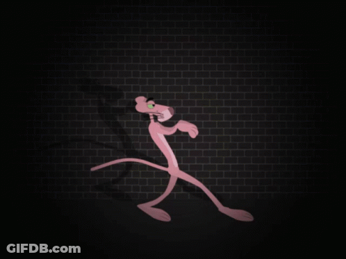 A Pink Panther Stands In Front Of A Brick Wall GIF