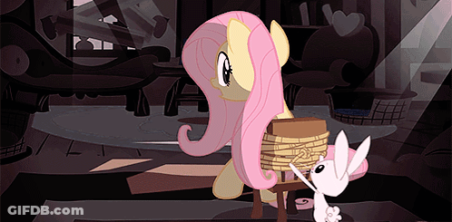 A Pink Pony Is Tied To A Chair Next To A White Pony GIF