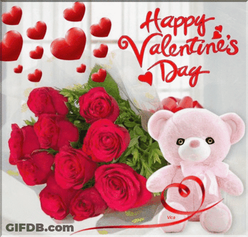 A Pink Teddy Bear Holding A Bouquet Of Red Roses Next To A Happy Valentine 'S Day Card GIF