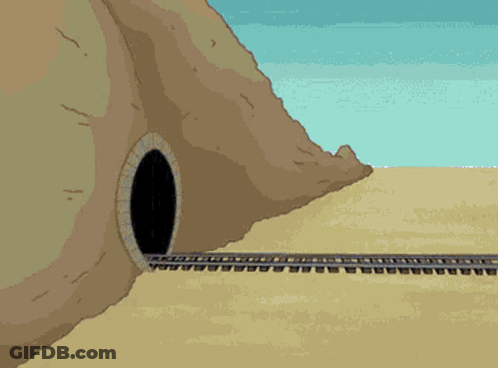 A Pink Train Is Going Through A Tunnel In The Desert GIF