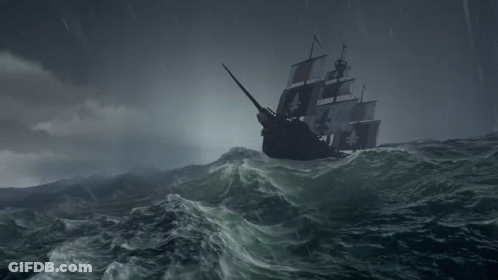 A Pirate Ship Is In The Middle Of The Ocean GIF