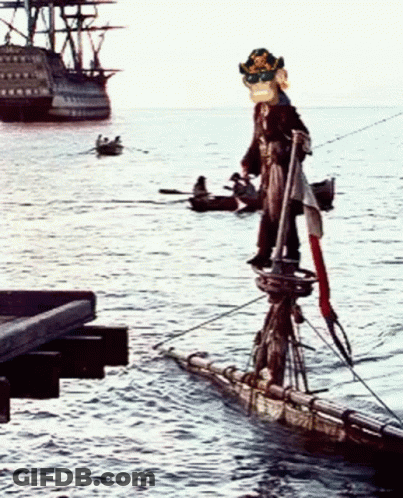 A Pirate Standing On A Raft In The Ocean GIF