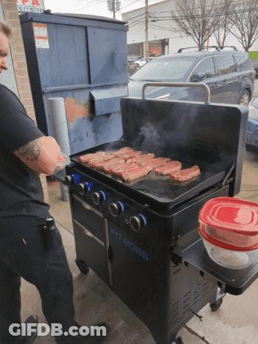 A Pit Boss Grill Is Being Used By A Man GIF