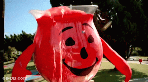 A Pitcher Of Kool Aid With A Smiling Face GIF