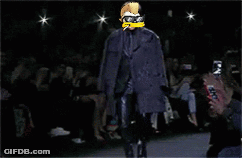 A Pixel Art Of A Man Walking Down A Runway Wearing Sunglasses And A Cigarette GIF