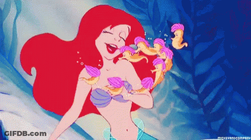 A Pixel Art Of Ariel From The Little Mermaid Surrounded By Seashells GIF