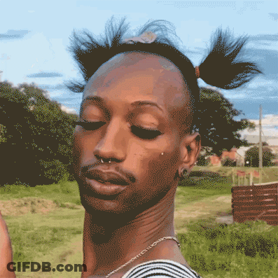 A Pixelated Drawing Of A Man With Pigtails And A Nose Ring GIF