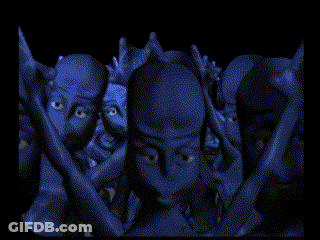 A Pixelated Image Of A Group Of People With Their Faces Covered In Blue Paint GIF