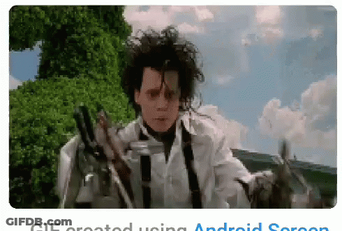 A Pixelated Image Of A Man Holding Scissors With The Words Gif Created Using Android Screen Below GIF