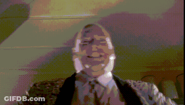 A Pixelated Image Of A Man In A Suit GIF
