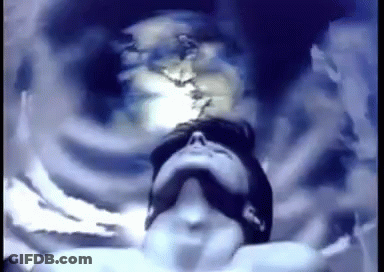 A Pixelated Image Of A Man Looking Up At Something GIF