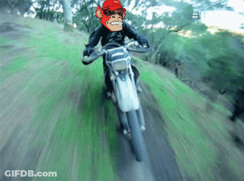A Pixelated Image Of A Man Riding A Motorcycle On A Grassy Hill GIF