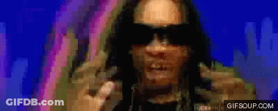 A Pixelated Image Of A Man Wearing Sunglasses With The Website Gifsoup.com In The Lower Right Corner GIF