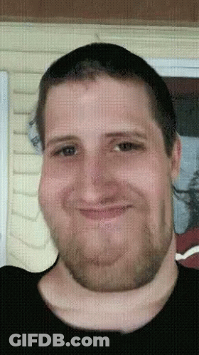 A Pixelated Image Of A Man With A Beard GIF