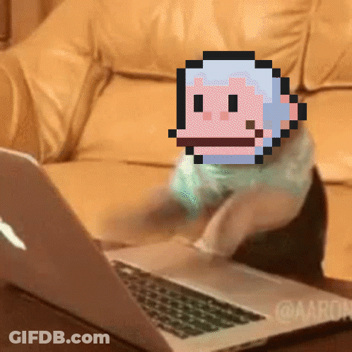 A Pixelated Image Of A Monkey Is On A Laptop GIF