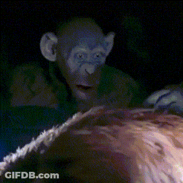 A Pixelated Image Of A Monkey Looking At A Woman 'S Face GIF
