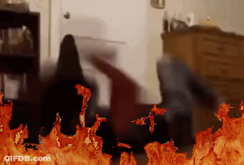 A Pixelated Image Of A Person Laying On The Floor With A Fire Behind Them GIF