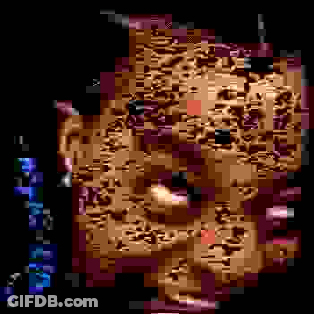 A Pixelated Image Of A Person 'S Face With A Purple Background GIF