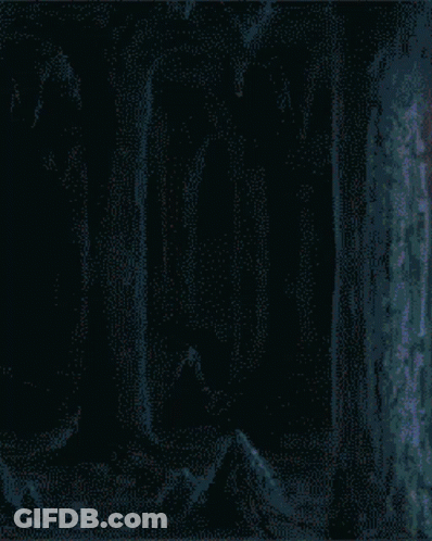 A Pixelated Image Of A Person With A Red Eye And The Letter N On The Bottom Right GIF
