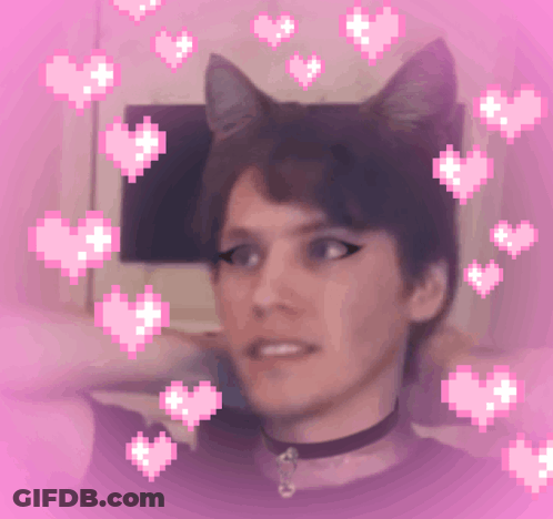 A Pixelated Image Of A Person With Cat Ears And Hearts Around Them GIF