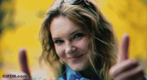 A Pixelated Image Of A Woman Giving A Thumbs Up Sign GIF