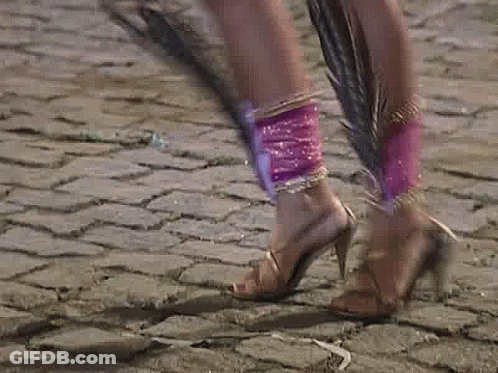 A Pixelated Image Of A Woman In A Pink Dress GIF