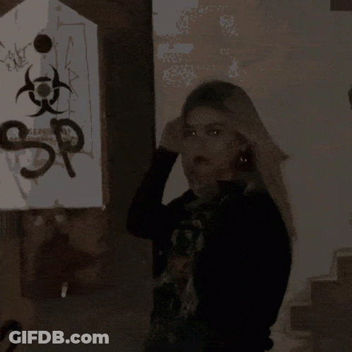 A Pixelated Image Of A Woman 'S Face With A Blurred Background GIF