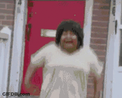 A Pixelated Image Of A Woman Standing In Front Of A Red Door With The Number 4 On It GIF
