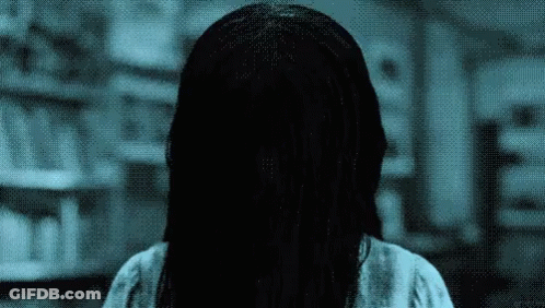 A Pixelated Image Of A Woman With Long Hair GIF