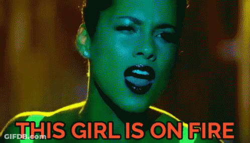 A Pixelated Image Of A Woman With The Words " This Girl Is On Fire " Above Her GIF