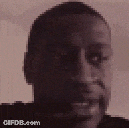 A Pixelated Picture Of A Man 'S Face With A Beard GIF