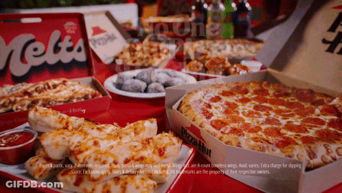 A Pizza Hut Advertisement Shows A Variety Of Pizzas On A Table GIF