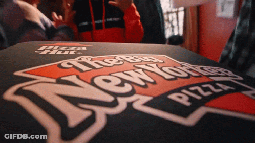 A Pizza Hut Box With The Big New York Pizza Logo On It GIF