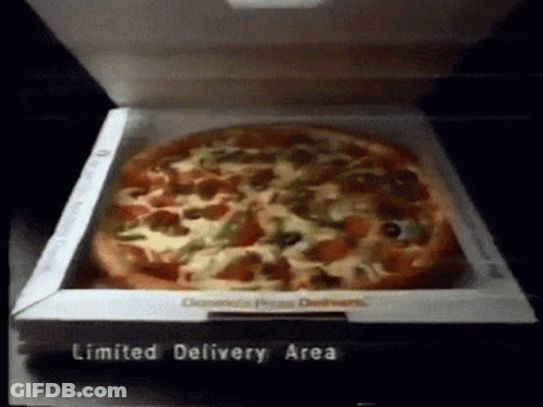 A Pizza In A Box That Says Limited Delivery Area On The Bottom GIF