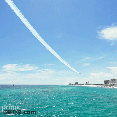 A Plane Flying Over A Body Of Water With The Word Prime In The Corner GIF