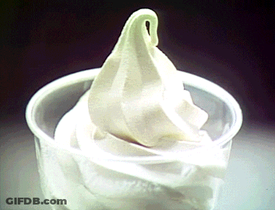 A Plastic Cup Filled With A Swirl Of Ice Cream GIF