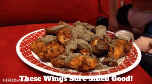 A Plate Of Chicken Wings With The Words " These Wings Sure Smell Good " On The Bottom GIF