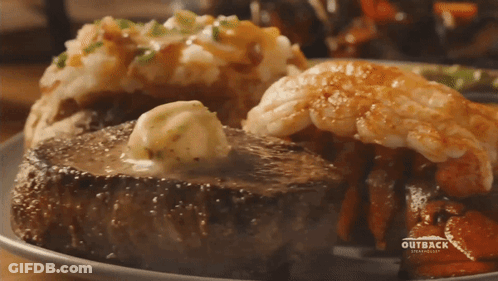 A Plate Of Food From Outback Steakhouse GIF