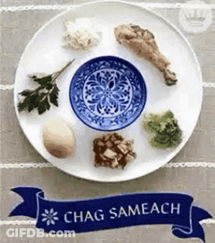 A Plate Of Food With A Banner That Says Chag Sameach On It GIF