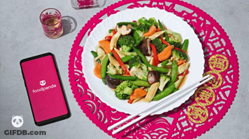 A Plate Of Food With Chopsticks Next To A Foodpanda App GIF