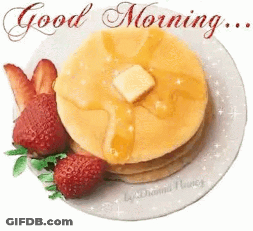 A Plate Of Pancakes With Syrup And Butter And Strawberries On A White Background . GIF
