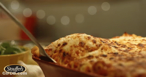 A Plate Of Stouffer 'S Lasagna Is Being Served GIF