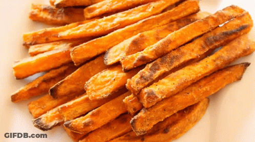 A Plate Of Sweet Potato Fries On A White Surface GIF