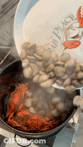 A Plate That Says The Crab Place Is Being Poured Into A Pot Of Clams GIF