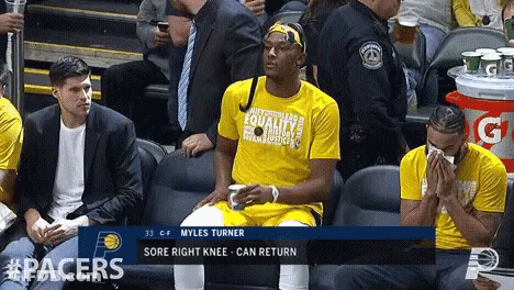 A Player Named Myles Turner Sits In The Stands GIF
