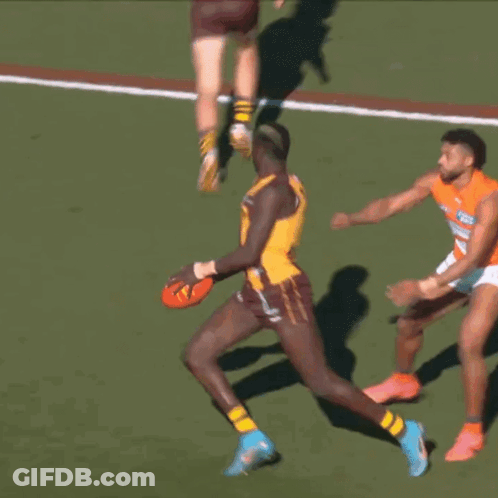A Player With The Number 11 On His Jersey Is Running With The Ball GIF