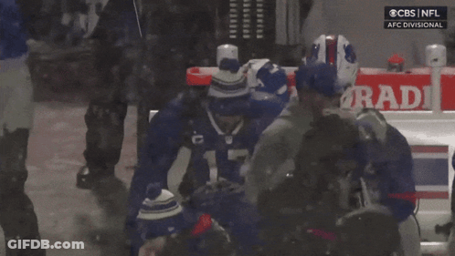 A Player With The Number 14 On Their Jersey Is Hugging Another Player GIF